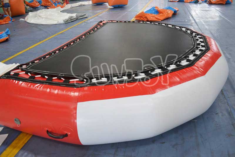 red white small inflatable trampoline side view