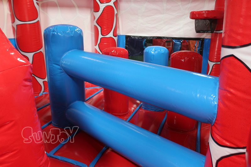 red bouncy castle combo inside obstacles