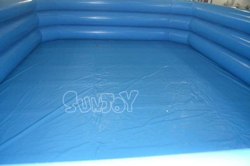 adults blue inflatable swimming pool inside