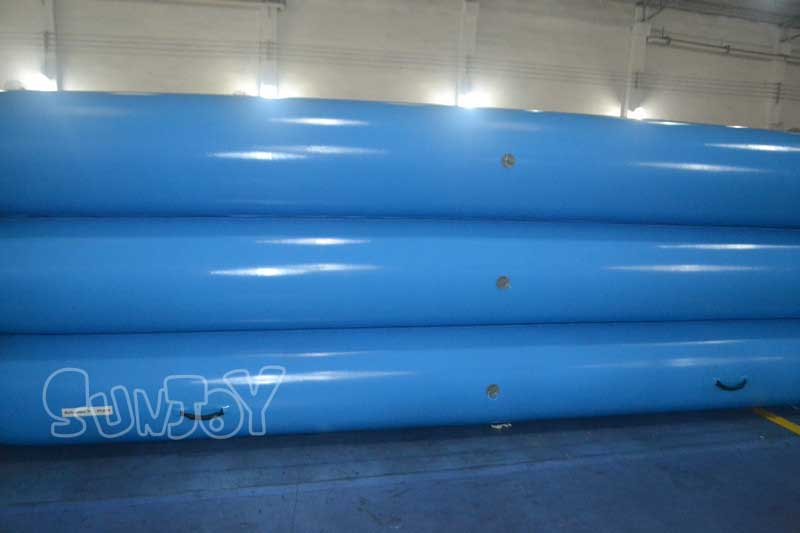 adults blue inflatable swimming pool outside