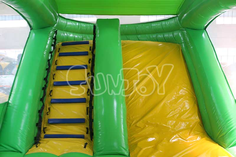 green dinosaur inflatable combo slide area
