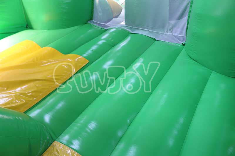 green dinosaur inflatable combo bounce area