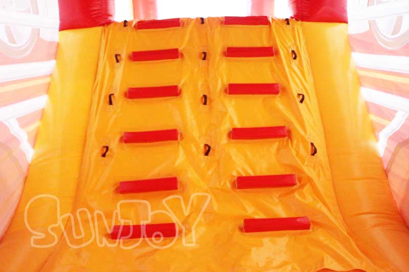 red truck inflatable obstacle course climb wall