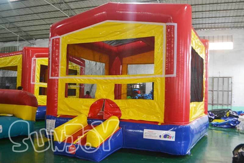 colorful bounce house with basketball hoop
