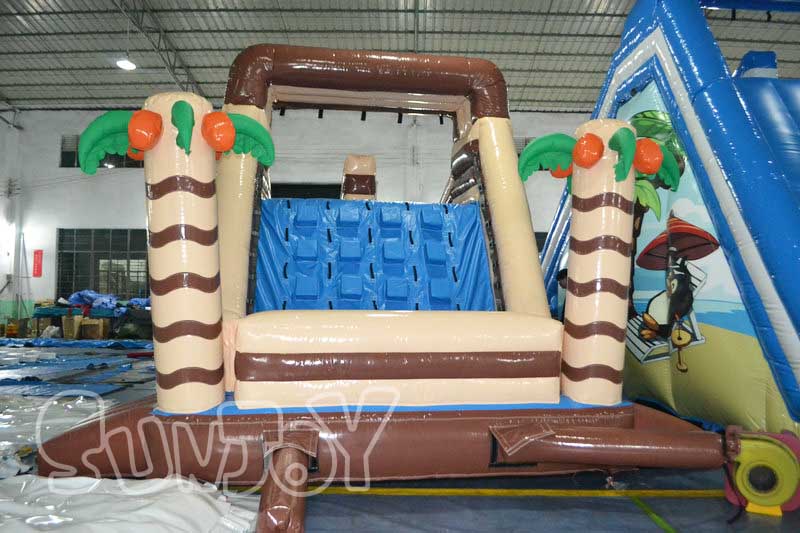 palm tree water slide climbing wall