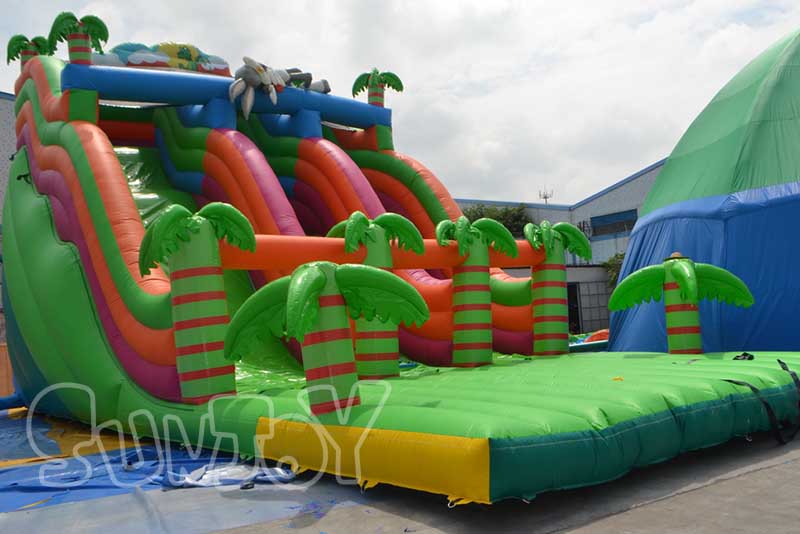 green palm trees large inflatable slide