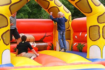 kids bouncing in bounce house