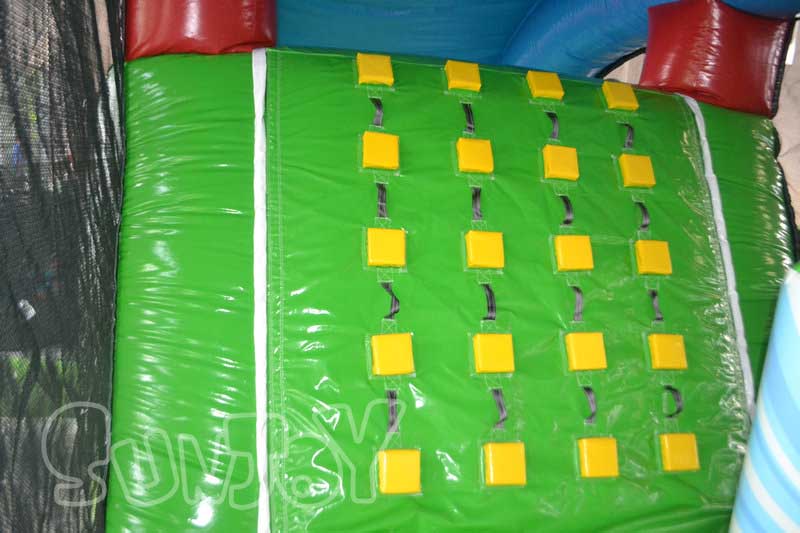 green climbing wall with yellow steps