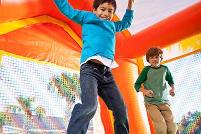 kids jumping in bounce house kids jumping in bounce house