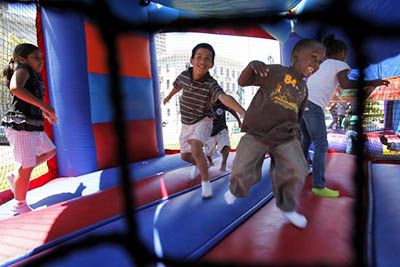 kids playing with bounce house