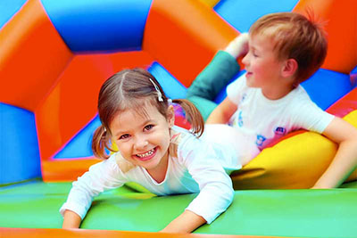 kids have fun in bounce house