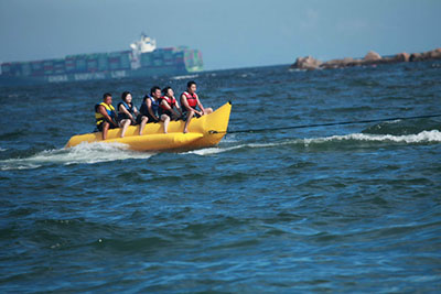 riding banana boat on the beach