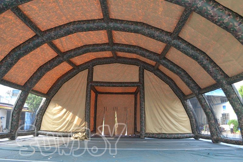 camouflage tent inside structure