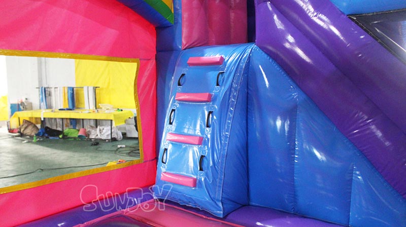 pink unicorn bouncy castle climbing stair