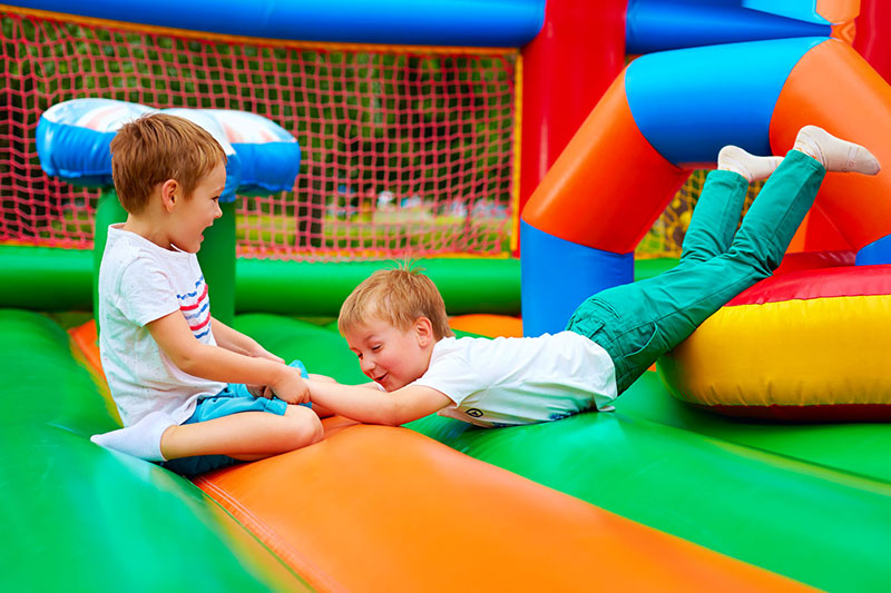 kids playing inflatable bouncer