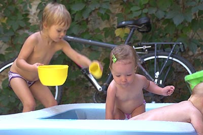 kids playing in inflatable pool