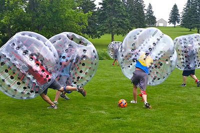playing bubble soccer game playing bubble soccer game